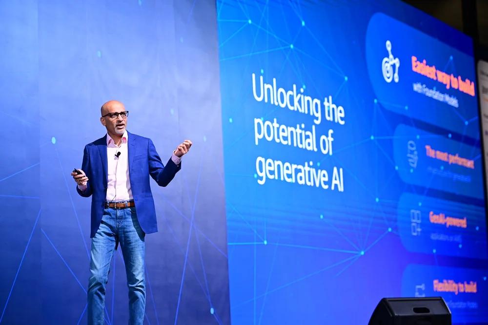 Ritesh Vajariya on stage delivering an AI keynote — Unlocking the potential of generative AI