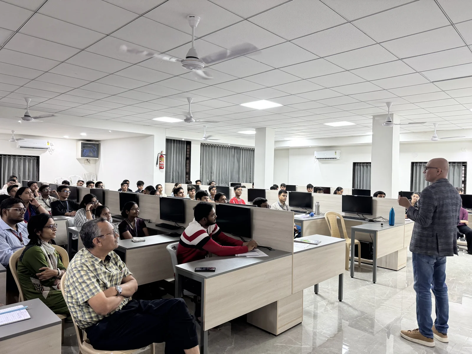 Engineering students engaged at workstations during an AI Guru lab session