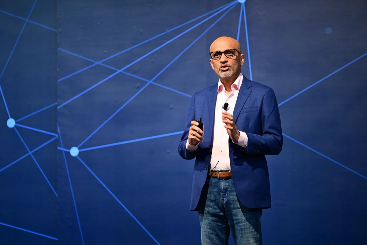 Ritesh Vajariya on stage delivering an AI keynote