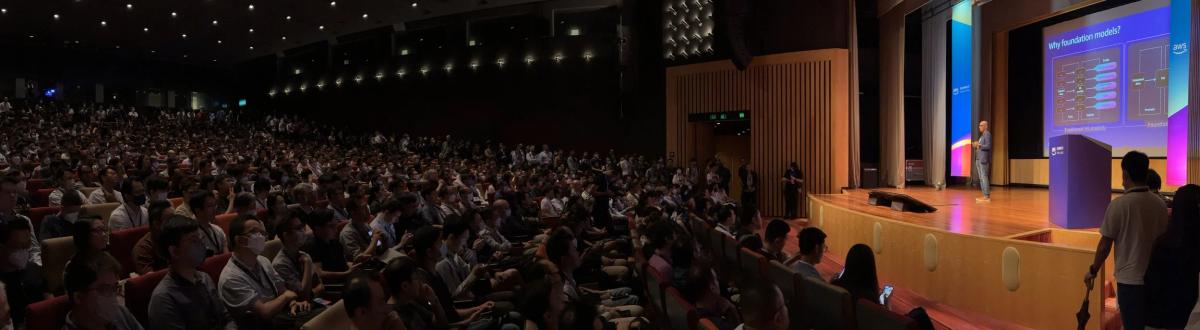 Ritesh on stage at an enterprise AI event in Hong Kong